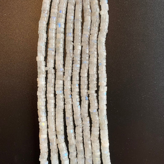 Close-up of Moonstone smooth wheel beads, highlighting their soft glow and natural translucency.