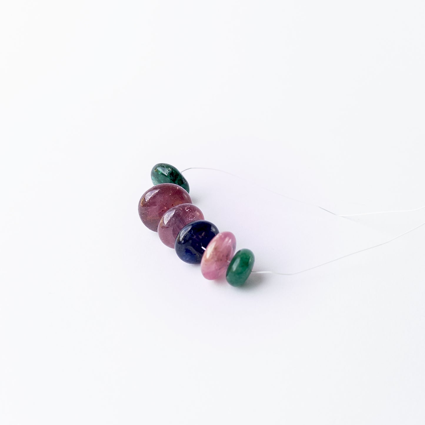 Authentic multi‑gemstone rondelle beads highlighting vibrant hues and premium bead quality.