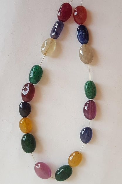  A vibrant multi-coloured strand featuring precious ruby, blue sapphire, yellow sapphire, and emerald beads on a white background.