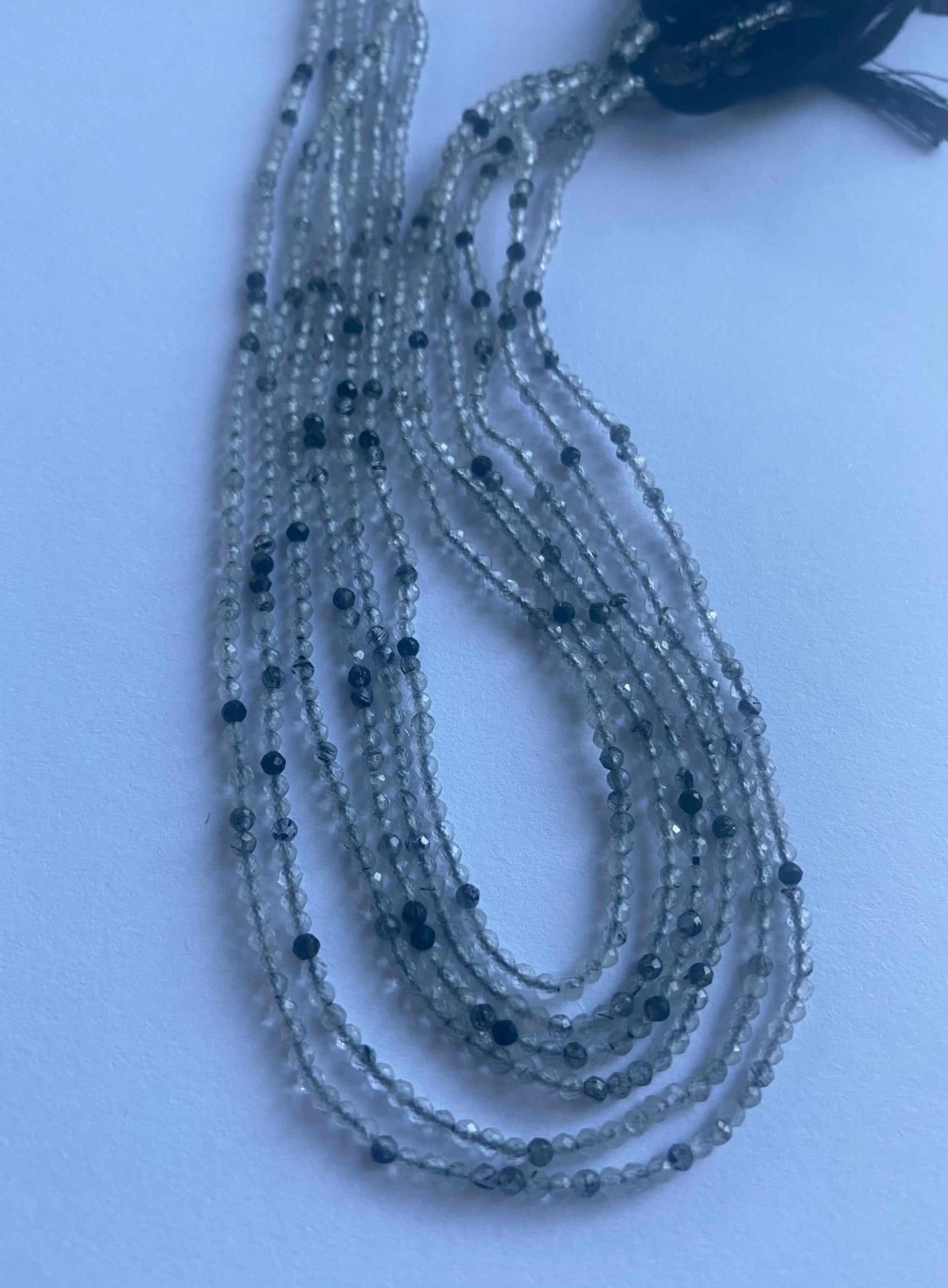 Stunning strand with 2mm Black Rutile micro faceted rondelle beads, ideal for a stylish accessory.