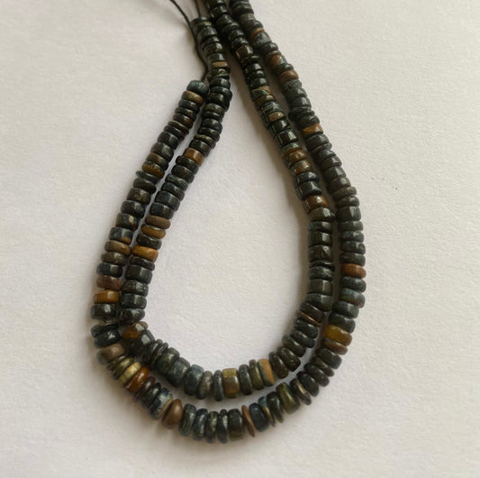 Stunning strand with 5mm to 5.5mm black tiger eye smooth wheel beads, ideal for a stylish accessory.