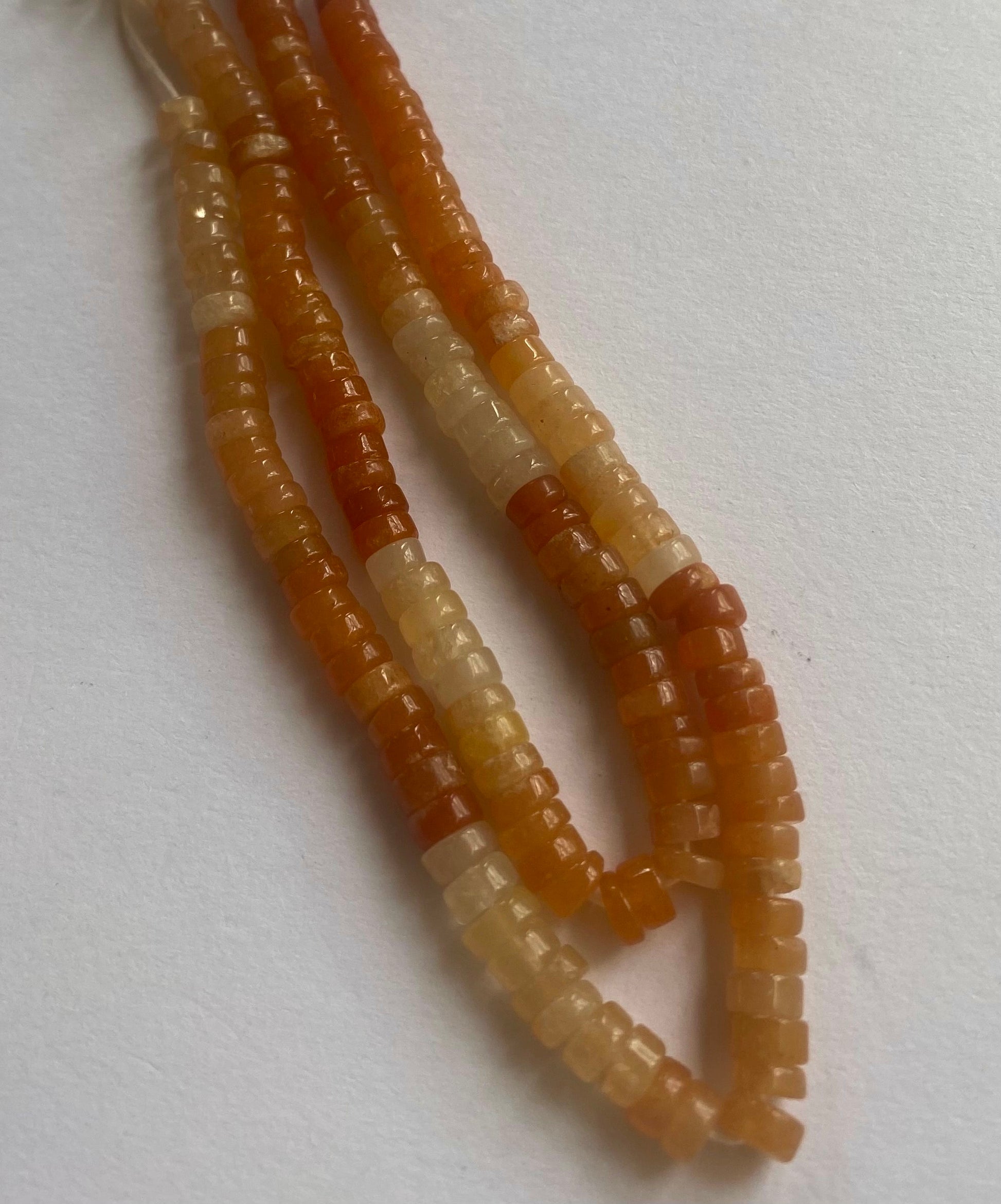  A collection of smooth Carnelian beads, sized 5.5mm, showcasing their stunning brilliance.  