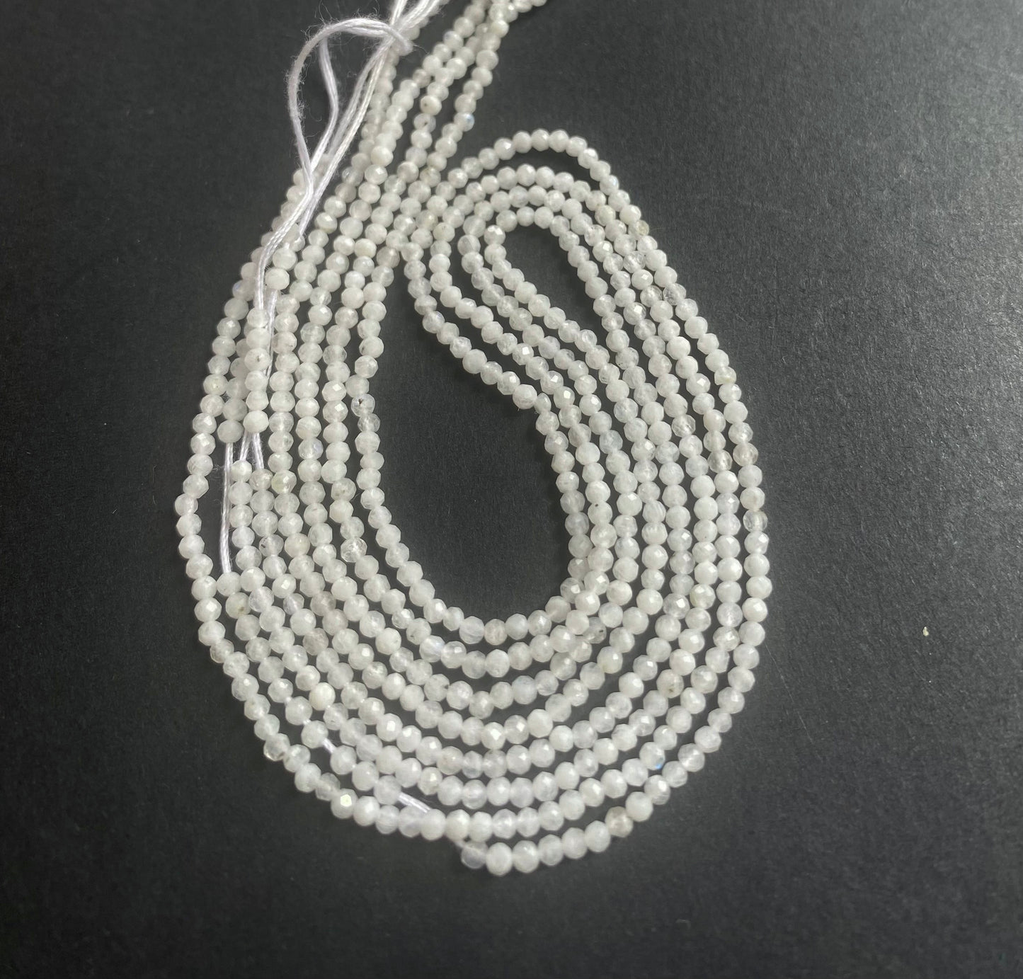 A striking strand of natural moonstone beads, with 2.1mm white faceted rondelles, perfect for adding colour to creations.