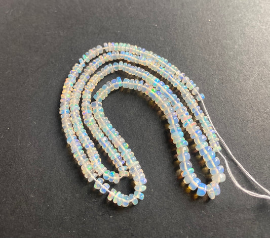 3.3-4.5mm  Opal gemstone beads on a strand, perfect for delicate beading projects.