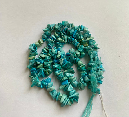 Elegant strand adorned with 5mm to 8mm natural turquoise chip stones, showcasing a rich blue colour.