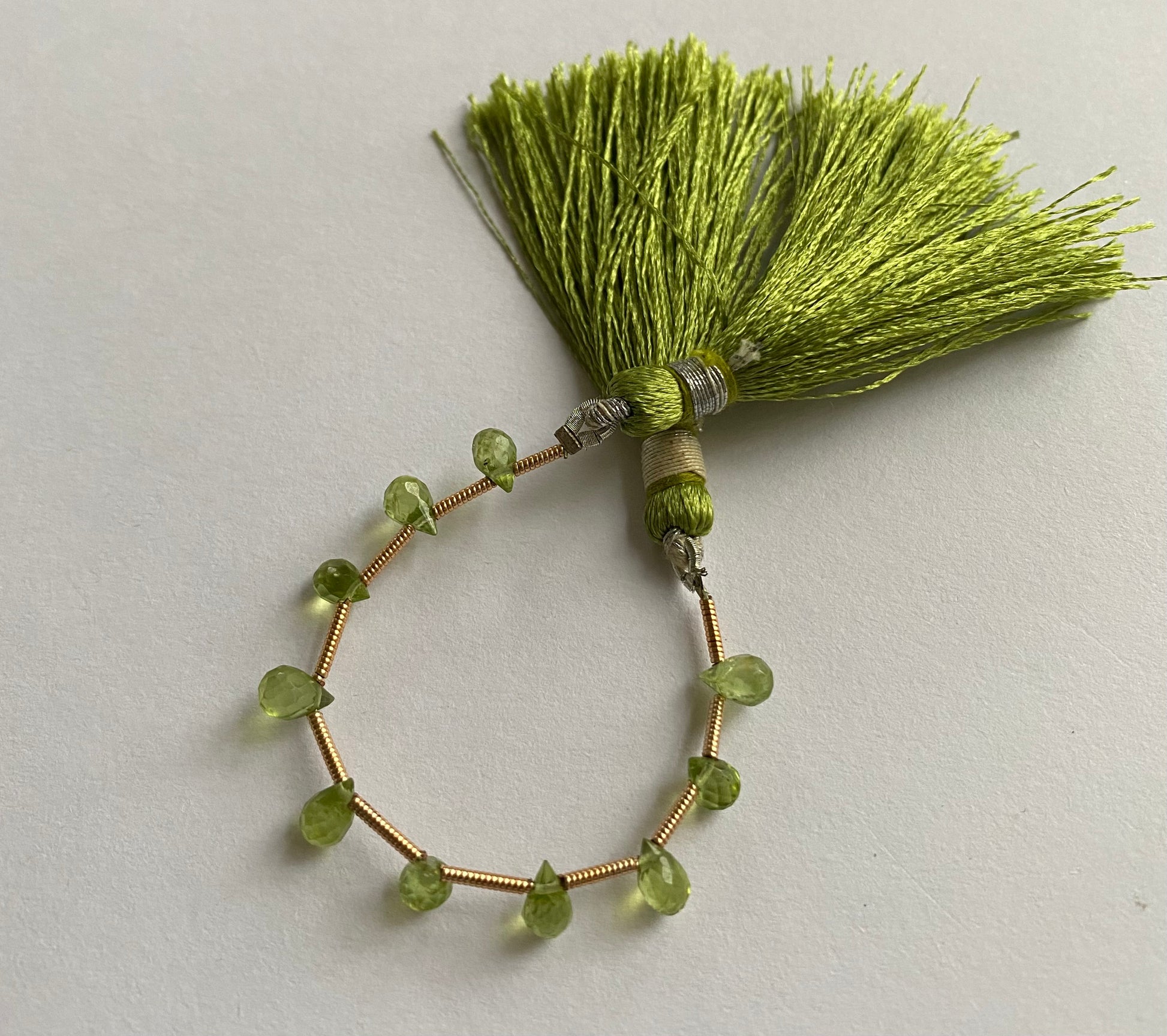  A vibrant strand of green peridot briolette beads, 3.7-4.4mm, beautifully threaded.