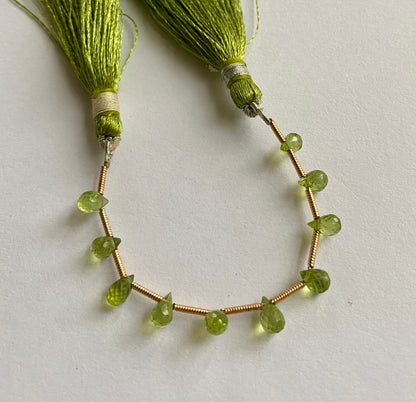 Beautiful  green peridot stones, tear-drop-shaped and faceted.