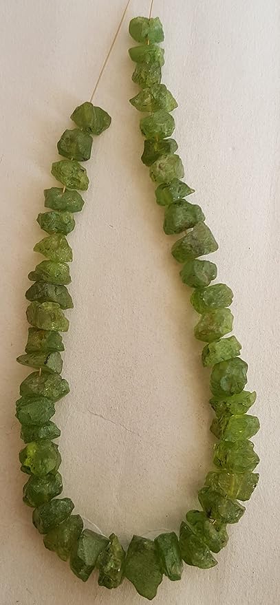 A strand crafted from peridot natural gemstone, radiating warmth and elegance.