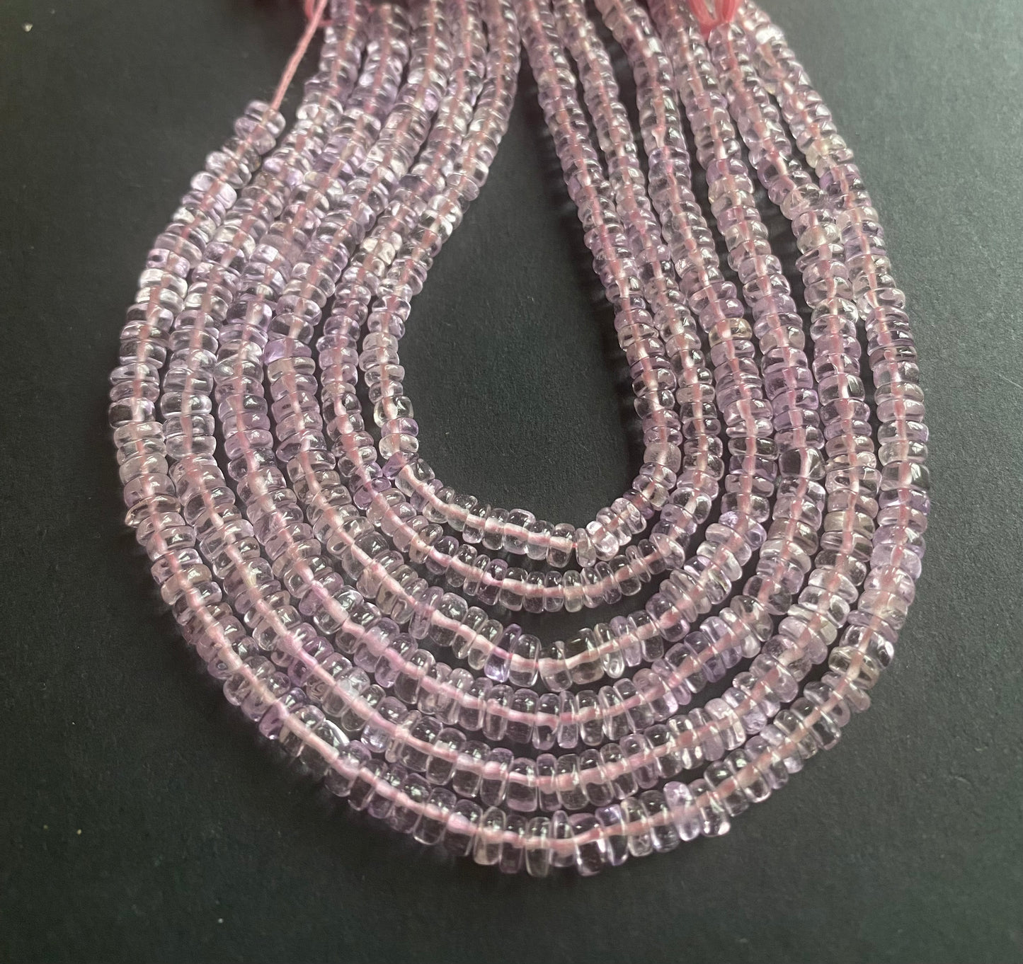 Elegant strand adorned with smooth wheel amethyst stones, showcasing a rich pink colour.