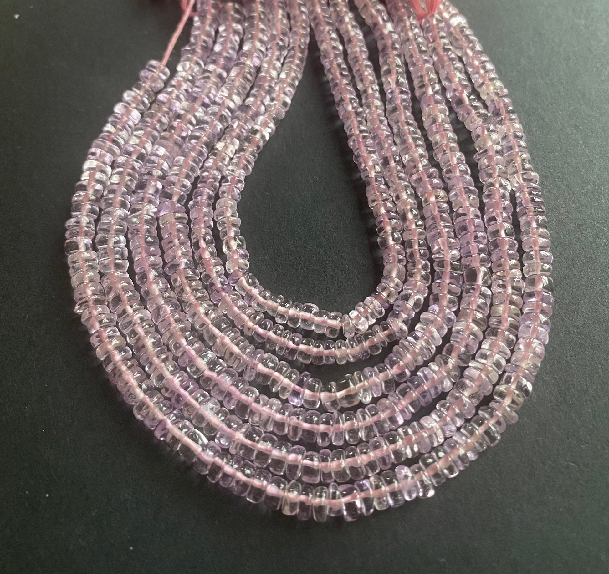 Elegant strand adorned with smooth wheel amethyst stones, showcasing a rich pink colour.
