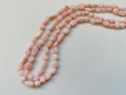  Featuring smooth opal beads, 4-5.5mm in size, showcasing a beautiful pink hue.