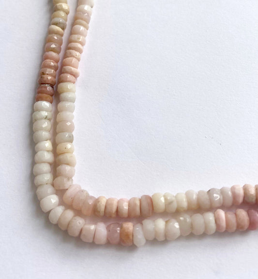 Pink Shaded Opal faceted rondelle beads with soft pink hues and polished surfaces.