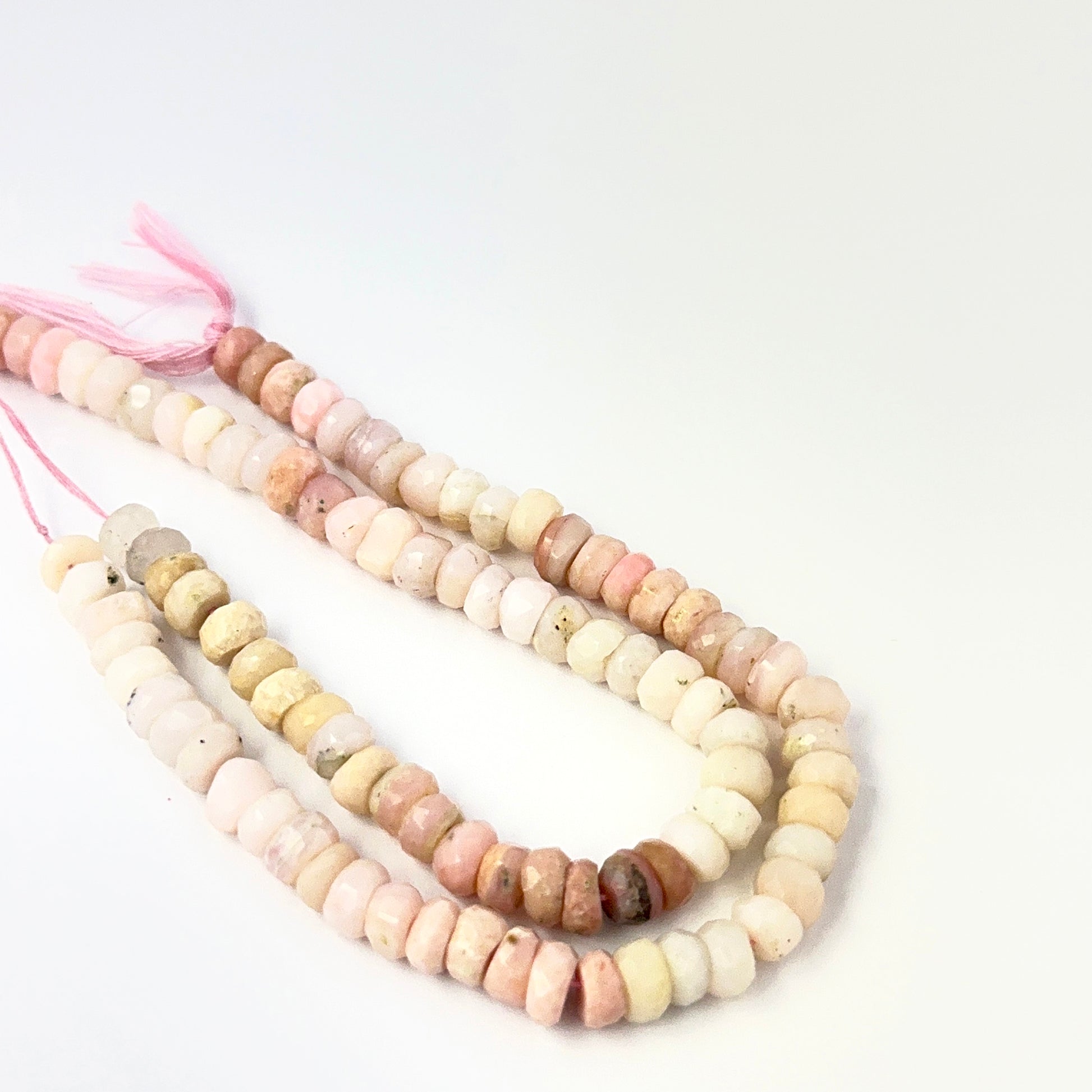 Pink Shaded Opal faceted rondelle gemstone beads, 6–6.5mm size, arranged on a 16cm strand for handmade jewellery makers.