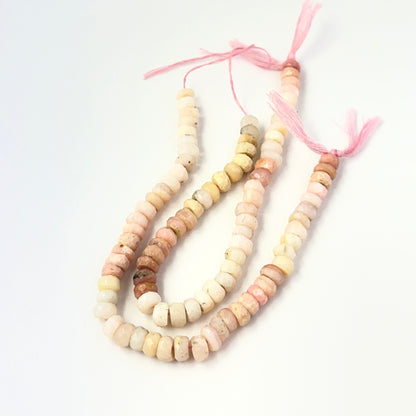 Genuine Pink Opal stone beads in faceted rondelle cut, showcasing soft blush tones for DIY jewellery design.