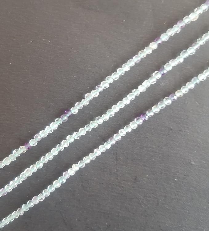 Vibrant strands of 2mm green and purple prehnite faceted rondelle beads, highlighting their natural elegance and charm.