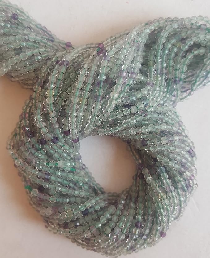 Striking strands of natural prehnite beads, with 2mm green and purple faceted rondelles, perfect for adding colour to creations.