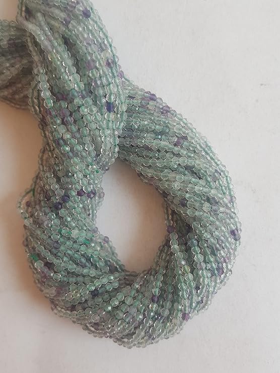 Beautiful strands of natural prehnite beads, featuring alternating green and purple faceted rondelles, perfect for jewellery making.