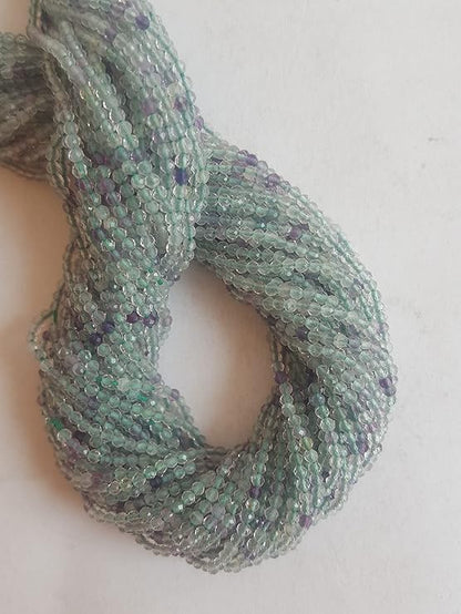 Beautiful strands of natural prehnite beads, featuring alternating green and purple faceted rondelles, perfect for jewellery making.