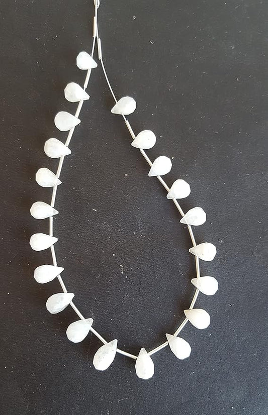 A strand featuring white beads and rainbow moonstone faceted teardrop beads, showcasing a delicate design.