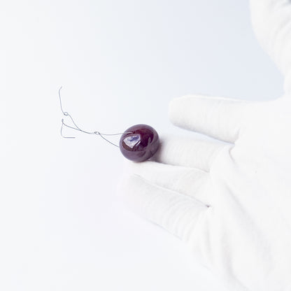 High‑quality Ruby stone bead highlighting its smooth cut and premium craftsmanship.