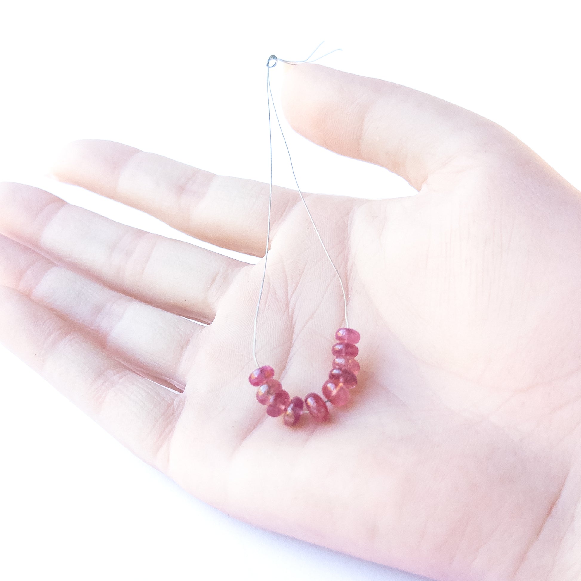High‑quality Ruby stone beads arranged neatly for handmade jewellery components and beadwork.