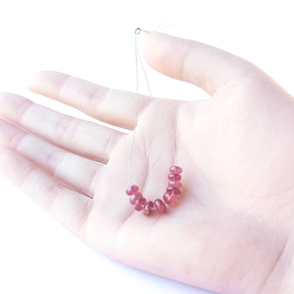 High‑quality Ruby stone beads arranged neatly for handmade jewellery components and beadwork.
