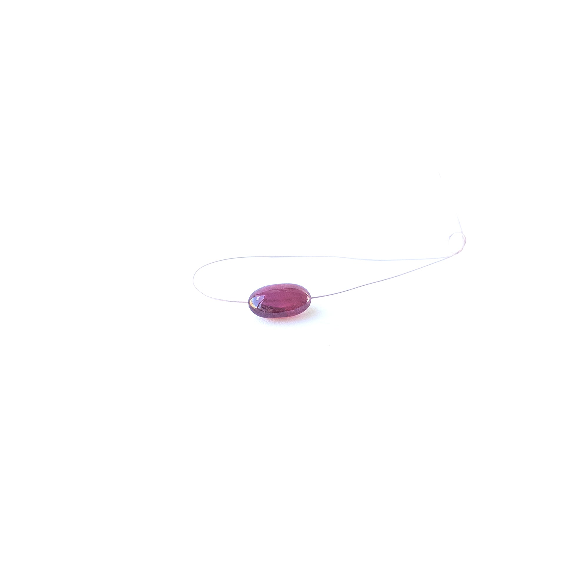 Ruby smooth tumble gemstone bead with deep red colour and polished shine, ideal for jewellery accents.