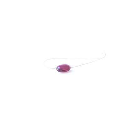 Ruby smooth tumble gemstone bead with deep red colour and polished shine, ideal for jewellery accents.