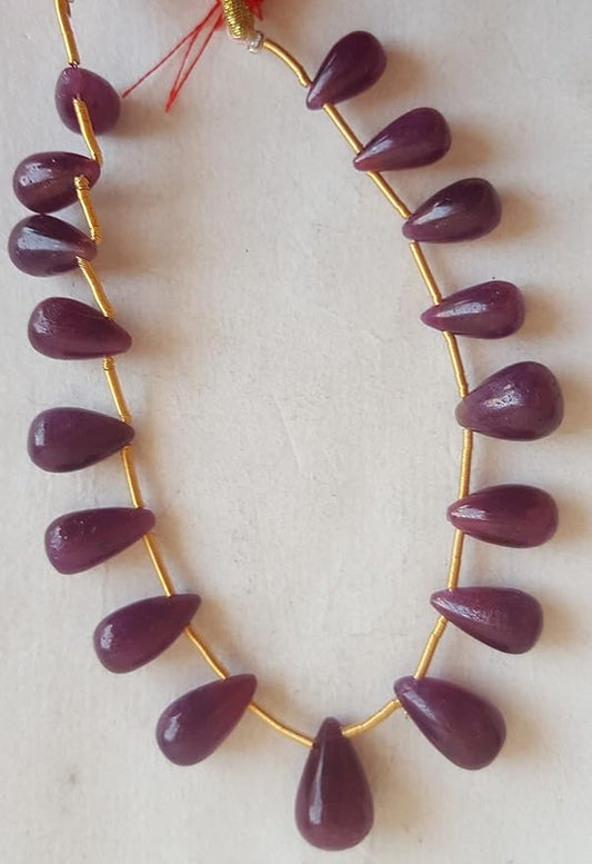 A striking strand with ruby, set on a white background.