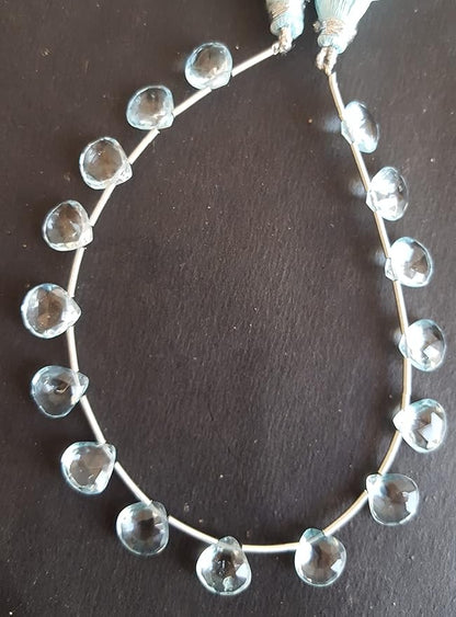 A stunning strand adorned with sky blue topaz gemstone beads, showcasing faceted heart shaped bead designs.
