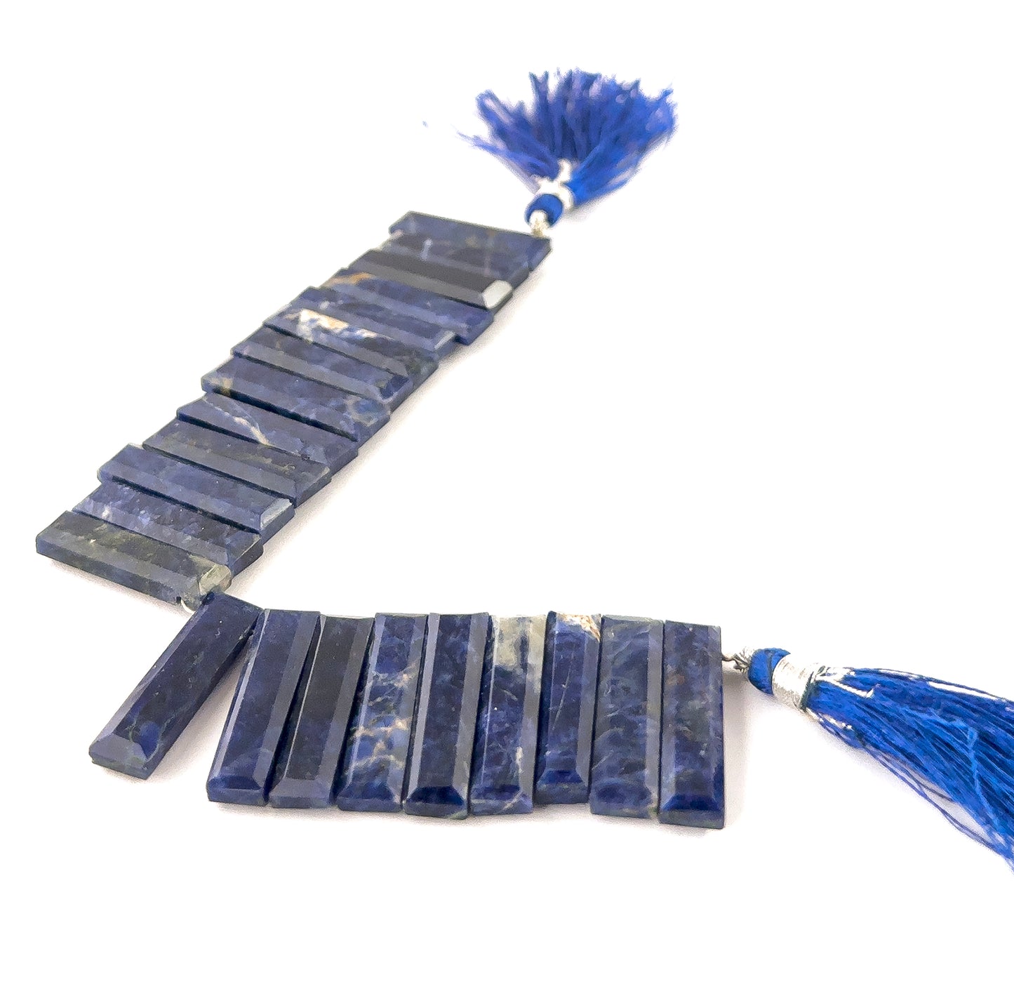 Sodalite faceted rectangle gemstones with crisp geometric cuts and rich ultramarine tones in a compact 15cm strand.
