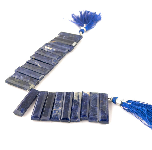 Sodalite faceted rectangle gemstones with crisp geometric cuts and rich ultramarine tones in a compact 15cm strand.