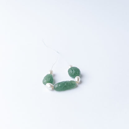 Carved tumble Green Strawberry Quartz and Shell Pearl stone beads with natural colour and refined finish.