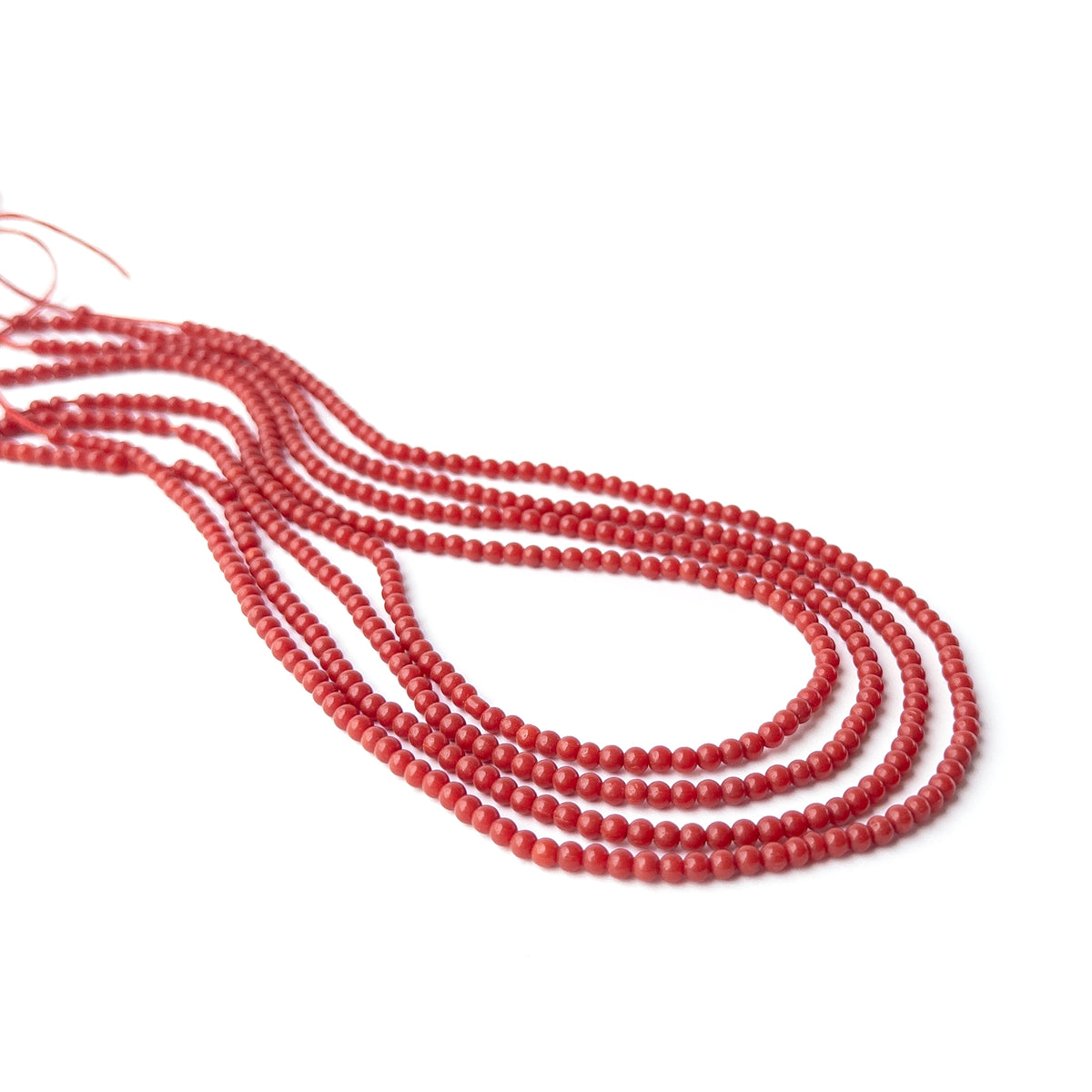Authentic Taiwan Coral stone beads featuring smooth round shapes ideal for elegant handmade jewellery creations.