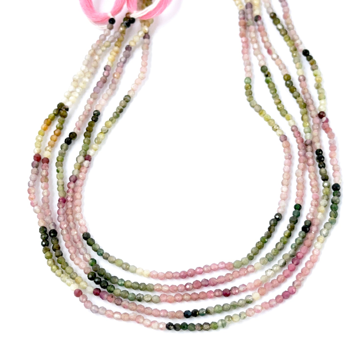 Natural Tourmaline faceted rondelle beads showing mixed colours and crisp gemstone cuts.