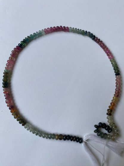 Vibrant multi-strand featuring 5mm tourmaline beads in various colours, highlighting their beauty.