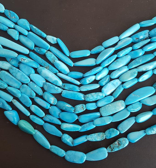 Strands of smooth turquoise beads, ranging from 6mm to 8mm in size, displayed together.