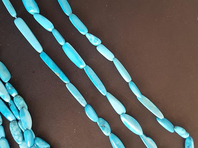 A vibrant assortment of smooth turquoise gemstone beads, measuring 6mm to 8mm, arranged in a group.