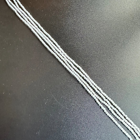 White Rainbow Moonstone faceted rondelle beads shimmer softly, elegantly arranged on a 31cm strand.