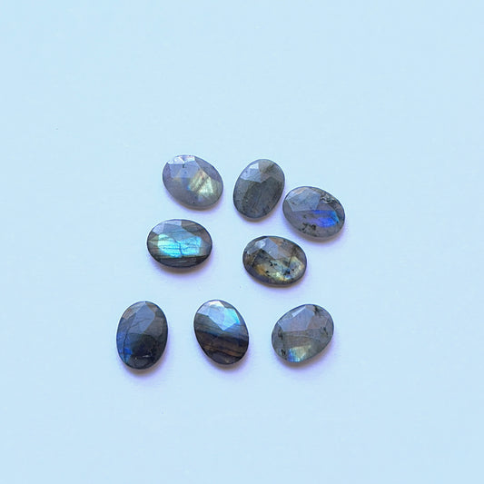 Labradorite cabochon natural gemstone showing blue‑green flash and polished finish for handmade jewellery components.