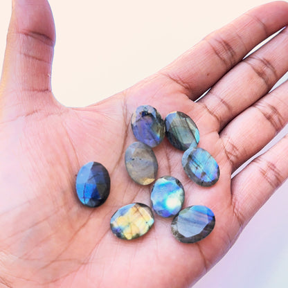 Detailed view of Labradorite cabochon showing polished surface, natural inclusions and vibrant colour play.