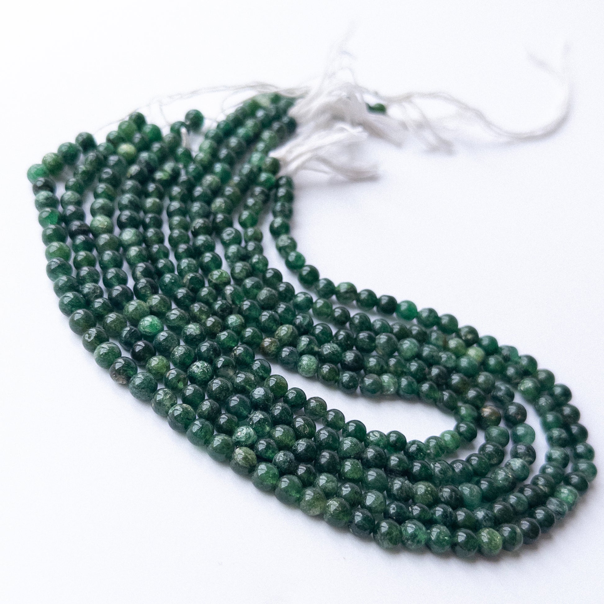 Aventurine smooth round beads in 5.7–5.9mm, showing soft green tones for handmade jewellery components.