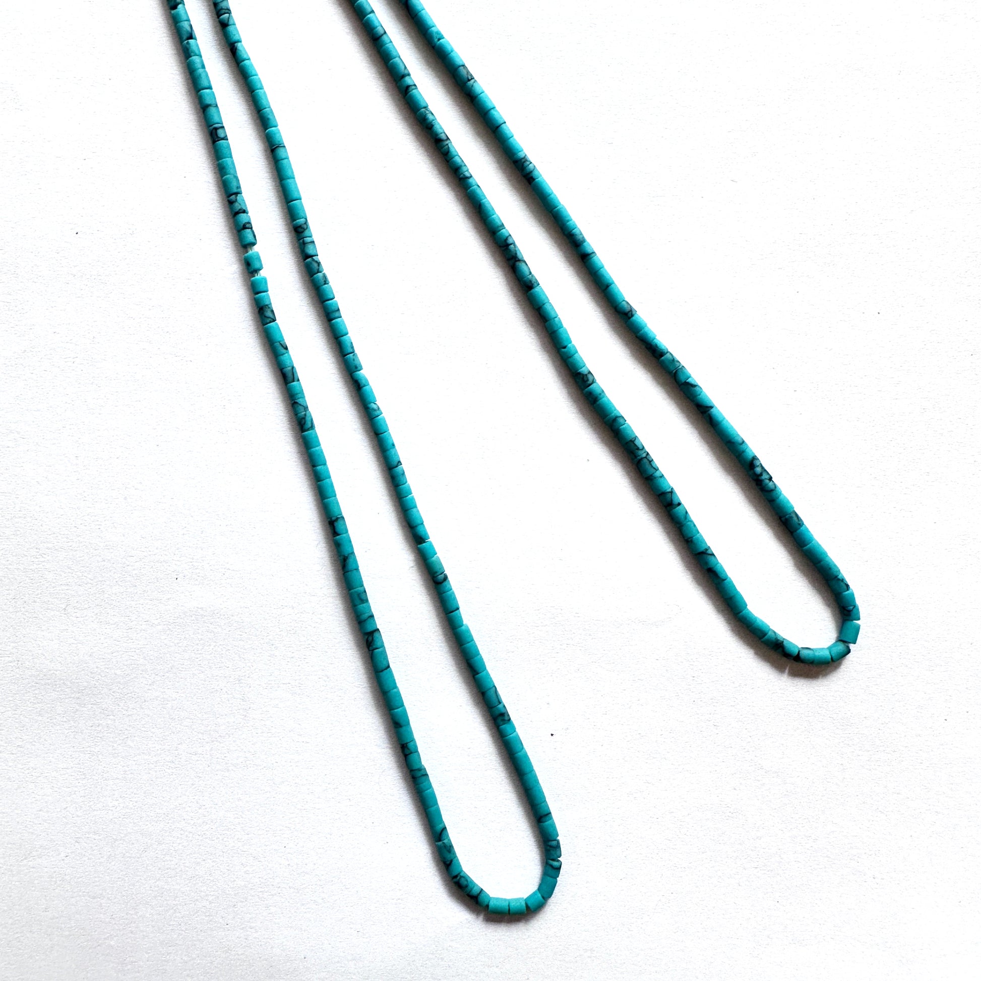 Afghan Heishi tube beads with 2–2.2mm size and smooth cylindrical cut on a 31cm strand.