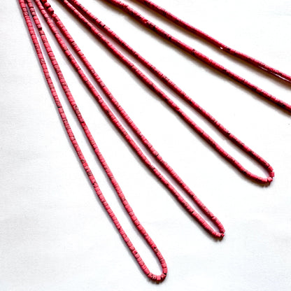 Tube shaped Heishi beads in Afghan style with earthy colours and 2.3–2.4mm sizing on 31cm strand.