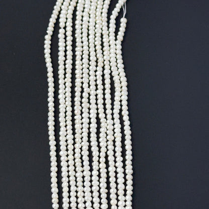 Close‑up of freshwater pearl rondelles showing detailed surface texture and soft pearl sheen.