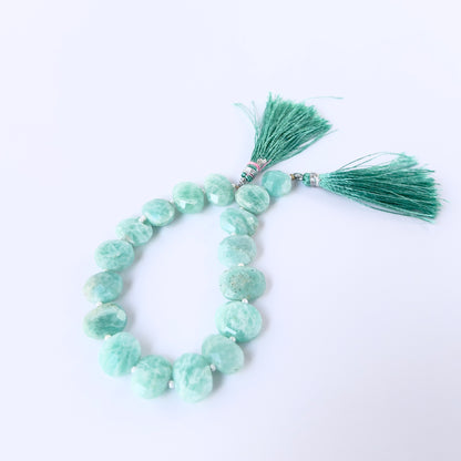 Close‑up of faceted Amazonite briolettes with polished shine, perfect for authentic gemstone bead jewellery.