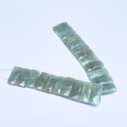 Close-up of Amazonite rectangle beads showing their clarity, cut, and natural inclusions.