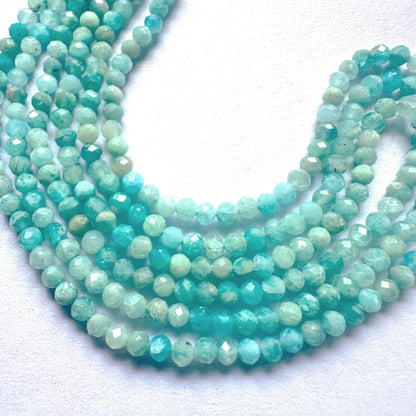 Amazonite gemstones arranged in a neat strand, showcasing their 2.7mm size and shimmering finish.