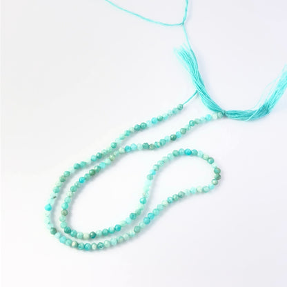 Amazonite faceted rondelle gemstone beads showing soft blue‑green tones and subtle sparkle.