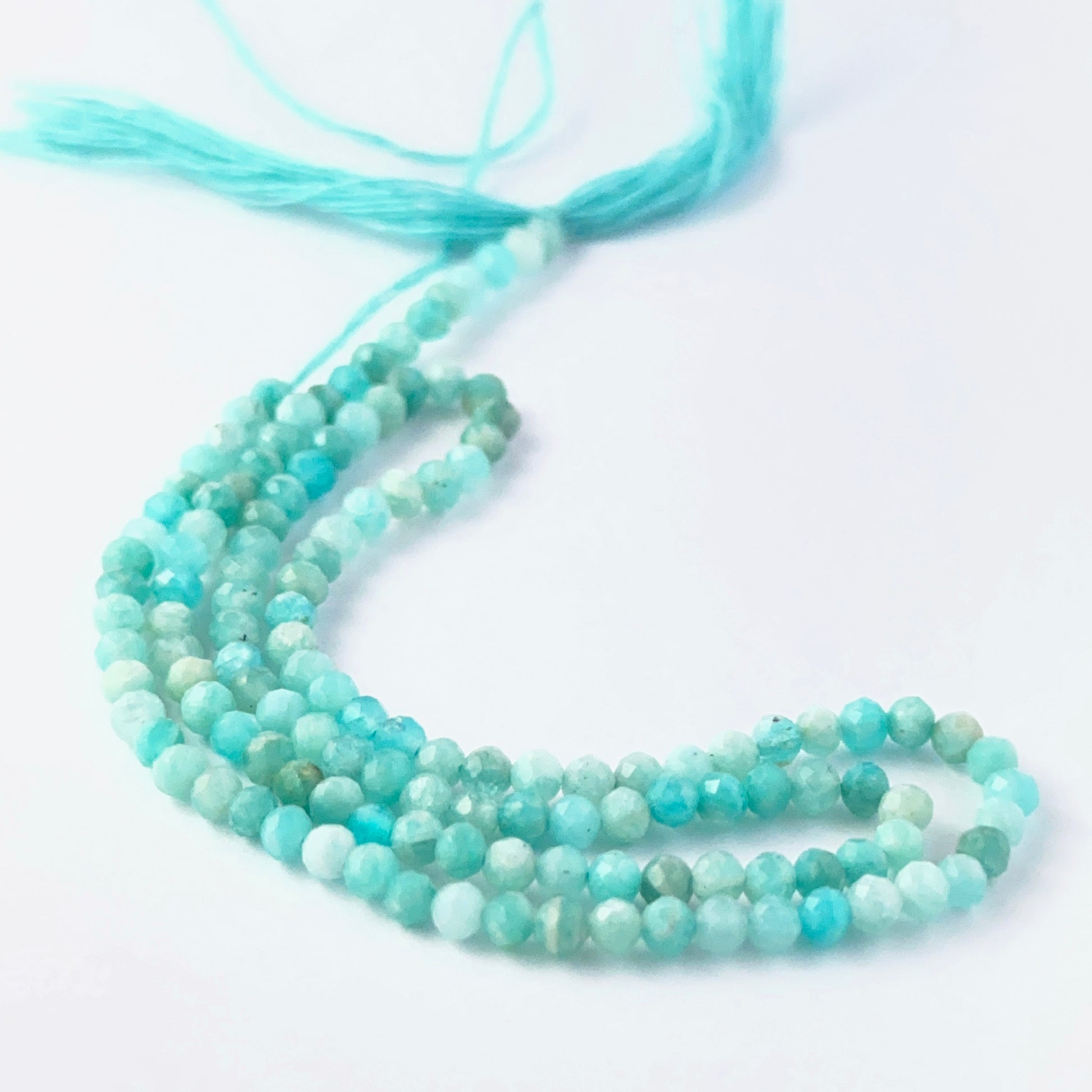 Close view of Amazonite faceted rondelle beads showing cut, clarity and premium gemstone quality.
